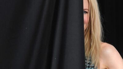 Presenter Nicole Kidman stands behind a screen as she waits to be photographed at the British Academy of Film and Television Awards at the Royal Albert Hall in London, Britain. Toby Melville / Reuters / February 12, 2017