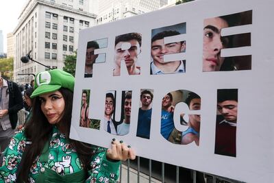 A supporter of Luigi Mangione demonstrates outside the court as Mangione attends a hearing in New York City on September 16. AFP