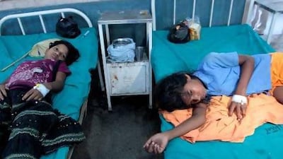 Indian school girls receive treatment after suffering from suspected food poisoning in Patna, India.