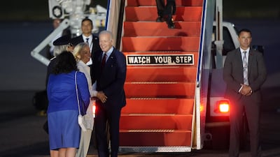 Mr Biden is welcomed by Jennifer Tolhurst, Lord-Lieutenant of Essex, Ms Hartley and Karen Pierce, British ambassador to the US, at Stansted Airport in Essex. PA