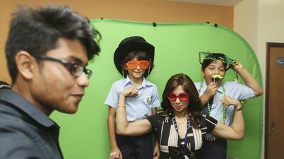 Pupils and staff at a photo booth session at the Green Flag Awards ceremony on Wedneasday. Sarah Dea / The National