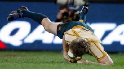 The Australian centre Peter Hynes scores a try against the New Zealand All Blacks during their Bledisloe Cup rugby test in Sydney, Australia.