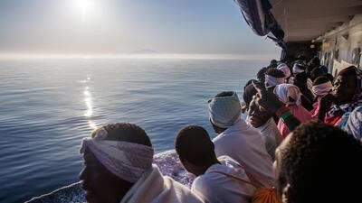Migrants look out from the 'Aquarius' vessel as they arrive in Trapani, western Sicily, Italy. Some 540 migrants were rescued by members of the NGO 'SOS Mediterranee' during 3 rescues operations off the Libyan coast in the Mediterranean Sea. Christophe Petit Tesson / EPA