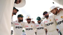 Pakistan captain Babar Azam speaks to his team during day four of the second Test against England at Lord's. Getty Images