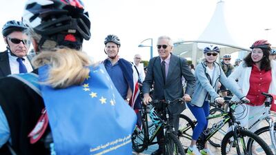 Patrizio Fondi, center, European Union ambassador to the UAE along with staff members of 13 European Union embassies gather along the Corniche to take part in Cycle To Work in Abu Dhabi. Christopher Pike / The National