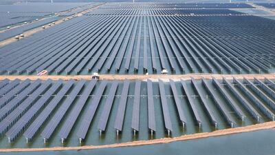 Solar panels and wind turbines at the new Huaneng Binzhou power generation project in Binzhou, in China’s eastern Shandong province. AFP
