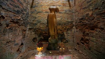 A religious figure is seen inside Sambor Prei Kuk, or 'the temple in the richness of the forest' an archaeological site of ancient Ishanapura, a UNESCO world heritage site, in Kampong Thom province, Cambodia. Samrang Pring / Reuters