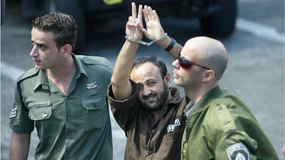 Barghouti, head of the Palestinian Fatah Tanzim and Al Aqsa Martyrs' Brigades, arrives at Tel Aviv District Court in May 2004 to face charges of murdering Israelis and leading Palestinian militants in terrorist attacks against Israeli targets. Getty Images