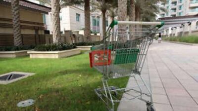 A trolley sits abandned on the grounds of Dubai Marina. The community's developer, Emaar, has imposed fines on those who disrupt the serenity and order of its properties.