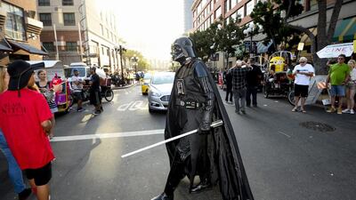A fan dressed as Star War's Darth Vader near Comic-Con at San Diego Convention Center. Denis Poroy / Invision / AP