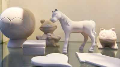 Pottery items ready for glazing at the studio.