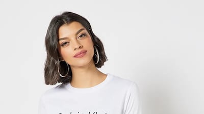 White organic cotton logo T-shirt; Dh226 (down from Dh285); Calvin Klein on Noon. Photo: Noon