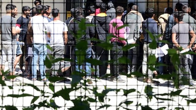 Migrants at the former military barracks in Blazuj, a suburb of Sarajevo, Bosnia and Herzegovina. According to the latest official data, there are currently more than 6,000 migrants in Bosnia and Herzegovina, who entered illegally in an attempt to reach some of the countries of Western Europe, mostly Germany, Italy and Austria. World Refugee Day is internationally observed on 20 June to raise awareness of the situation of refugees around the world. EPA