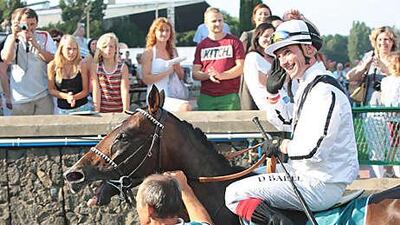 David Badel celebrates his win at the Sluzewiec Racetrack.