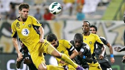 Al Wasl's Emiliano Alfaro heads the ball during the Etisalat Cup match against Al Dhafra. Jeff Topping / The National