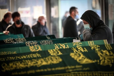 A man mourns the death of a relative from Covid-19 at the Kucukcekmece Municipality Morgue in Istanbul last week. Starting on November 15, Turkey experienced 16 consecutive days of record Covid-related deaths. EPA