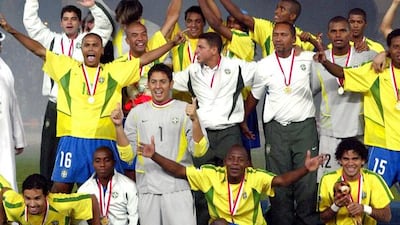 Brazilian players pose for a picture after winning the final of the 2003 Fifa World Youth Championship against Spain at Zayed Sports City Stadium in Abu Dhabi. Karim Jaafar / AFP / December 19, 2003