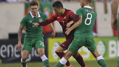 Cristiano Ronaldo of Portugal in action against the Ireland's Stephen Kelly, left, and David Meyler, right, during their World Cup 2014 international friendly warmup on Tuesday. Jose Sean Goulao / EPA / June 10, 2014