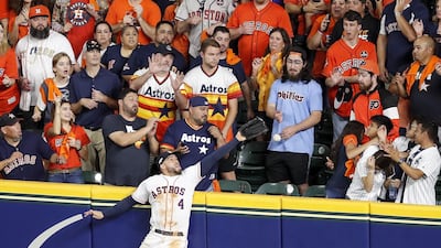 George Springer of the Houston Astros failes to stop a home run by New York Yankees DJ LeMahieu at Minute Maid Park in Texas on Saturday, October 19. AFP