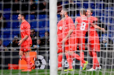 Real Madrid defender Sergio Ramos, right, celebrates with teammates after scoring against Espanyol. Josep Lago / AFP