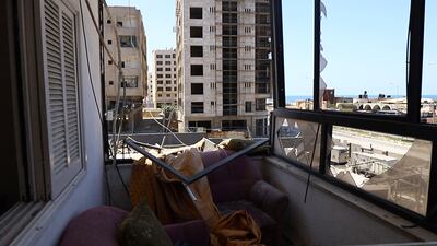A view from a building next to the Hanadi high-rise, which was also affected by Israeli warplanes' strike . Rakan Abed El Rahman for The National