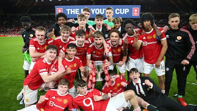 MANCHESTER, ENGLAND - MAY 11: Rhys Bennett of Manchester United celebrates with the FA Youth Cup trophy following victory in the FA Youth Cup Final match between Manchester United and Nottingham Forest at Old Trafford on May 11, 2022 in Manchester, England. (Photo by Alex Livesey / Getty Images)