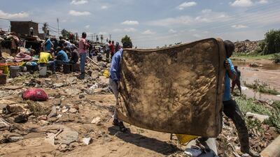 Salvaged mattresses are left out to dry on the banks of the Jukskei River in Alexandra Township, north of Johannesburg, South Africa, on November 10, 2016, after floodwaters ravaged over two hundred homes. Gulshan Khan / Agence France-Presse