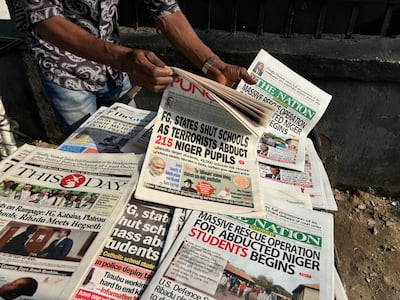 A street vendor in Nigeria's financial hub Lagos with newspapers with headlines on the abduction. AP