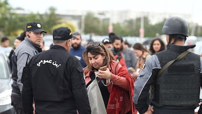 Police secure the scene of an explosion as forensic experts work near the US embassy in the Tunisian capital Tunis. AFP