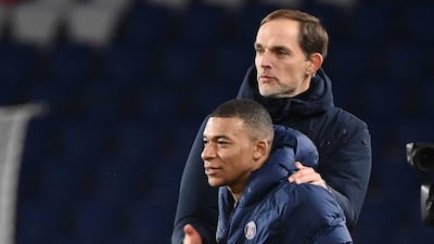 Paris Saint-Germain's French forward Kylian Mbappe celebrates with German coach Thomas Tuchel. AFP