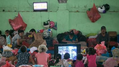 Balinese residents stay at an emergency shelter in Klungkung, Bali, Indonesia, after Mount Agung erupts on the holiday island. Made Nagi / EPA