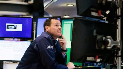 A trader works on the floor of the New York Stock Exchange. Steady improvements in gauges of market momentum and sentiment in recent weeks reinforced the view among some investors that asset prices may be heading for a more benign period. EPA
