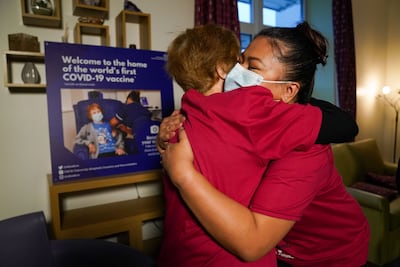Margaret Keenan embraces nurse May Parsons at University Hospital Coventry & Warwickshire, a year after Margaret was the first person in the United Kingdom to receive the Pfizer-BioNtech Covid-19 vaccine. PA