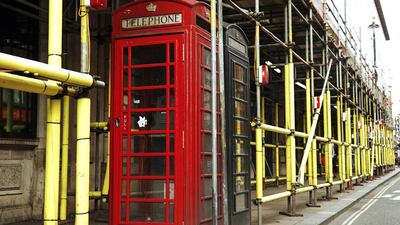 Telephone boxes are surrounded by scaffolding at a construction site in central London. Construction output in Britain grew at its fastest pace in seven months in August, boosting job creation but also putting strain on suppliers, industry data show. Luke MacGregor / Reuters