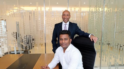 Sunil Gomes, standing, CEO Gemini Property Developers and Asadul Khan, logistics manager. Mr Khan’s wife is a teacher in India and he hopes to bring her here Chris Whiteoak / The National