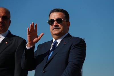 06 January 2026, Iraq, Baghdad: Iraqi Prime Minister Mohammed Shia al-Sudani (C) waves to the newly graduated Iraqi Army officers during the 105th Iraqi Army Day parade from a military vehicle in Baghdad. Photo: Ameer Al-Mohammedawi/dpa (Photo by Ameer Al-Mohammedawi/picture alliance via Getty Images)