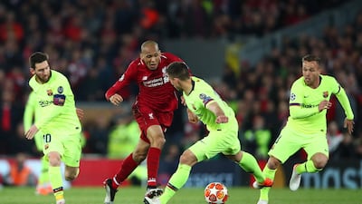 Liverpool's Fabinho under pressure from Lionel Messi and Clement Lenglet of Barcelona. Getty