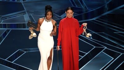 TWO WOMEN WHO WORE 'AN OLD' DRESS: While the escapism is half the attraction, isn’t it refreshing to find stars who still think and act like normal people? Tiffany Haddish is one. Haddish charmed us all by wearing the same dress to three events (for an SNL appearance, a Girls Trip Premiere and on the Oscars stage). The piece in question is a rather delicious white, halter neck gown, with a split thigh and heavy embellishment around the neck. By Alexander McQueen, it looks amazing on her and at US$4,000, she admits it was a big purchase. And while others may secretly swallow the cost and pretend funds are limitless, Haddish has announced to the world she is intent on getting her money’s worth. So, while she arrived at last night's bash wearing a traditional Eritrean robe (in memory of her late father), she then changed into her fail-safe McQueen to take to the stage. And the best thing? Both her and her co-presenter Maya Rudolph walked on stage in comfy slippers, carrying their high heels in hand. Bless. AP