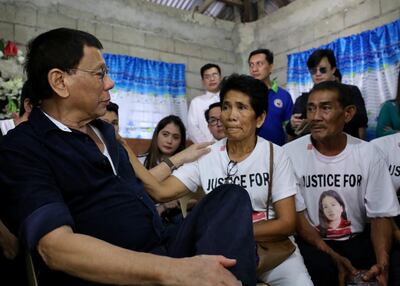 Philippine President Rodrigo Duterte speaking to the parents of Joanna Demafelis during a wake in the town of Sara, Philippines in February 2018. EPA