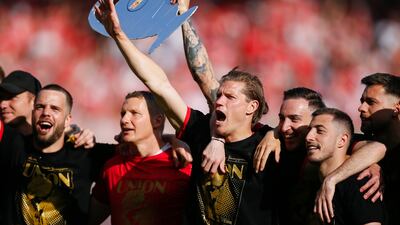 BERLIN, GERMANY - MAY 27: the team of Union Berlin with Kevin Behrens (M) celebrate their teams win during the Bundesliga match between 1. FC Union Berlin and SV Werder Bremen at Stadion an der alten Försterei on May 27, 2023 in Berlin, Germany. (Photo by Selim Sudheimer / Getty Images)