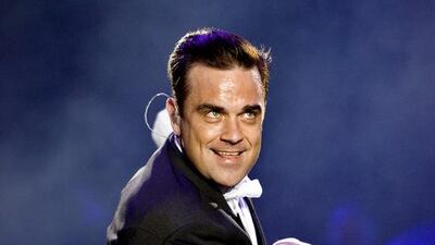 Robbie Williams performs at Du Arena, Yas Island on Saturday, April 25, 2015. Patricia De Melo Moreira / AFP