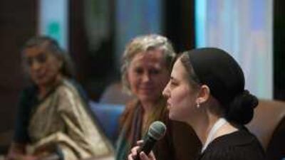 Rori Picker-Neiss, right, Rev Serene Jones and K Thilagawathi Kanagaretnam, left, speak at the interfaith panel.
