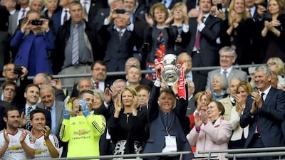 Louis van Gaal Manager of Manchester United lifts the trophy after winning The Emirates FA Cup Final match between Manchester United and Crystal Palace at Wembley Stadium on May 21, 2016. Getty