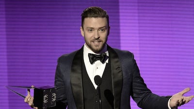 Singer Justin Timberlake accepts Favorite Pop/Rock Male Artist award onstage during the 2013 American Music Awards. Kevin Winter / Getty Images / AFP