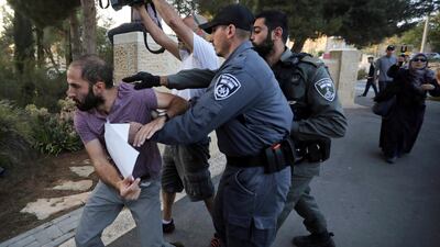 In this October 1, 2019 file photo, Israeli police push a man during a protest outside a hospital in Jerusalem where Samir Arbeed, a Palestinian suspect in a deadly West Bank bombing, is being treated. AP