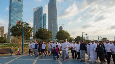 Sheikh Abdullah bin Zayed, Minister for Foreign Affairs, walks with MoFA staff and families as part of the Ministry’s healthcare programme.