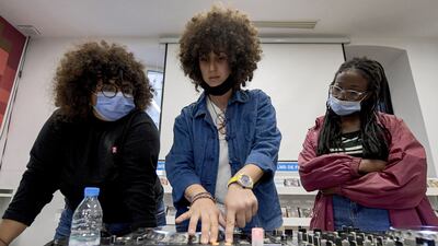 Yasmina Gaida (C) - known professionally as Fouchika Junior - gives a demonstration before students during a DJ mixing class as part of the "DJ Academy for Girls" at the French Institute of Tunisia. In three years, the "DJ Academy for Girls", supported by international foundations, has trained around 100 female DJs. The Academy offers its workshops on weekends for an affordable amount (80-90 euros for a 36-hour module over three months). It is also intended to be a "second chance school to provide a second job or an additional salary". All photos: AFP