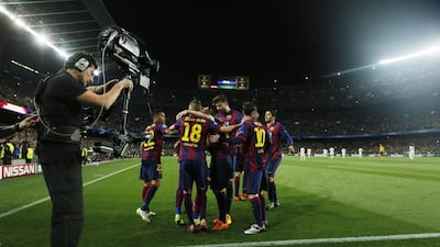 Neymar (hidden) celebrates with teammates after scoring the second goal for Barcelona in their Uefa Champions League quarter-final second leg victory over Paris Saint-Germain on Tuesday at Camp Nou. Albert Gea / Reuters