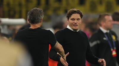 PSG manager Luis Enrique shakes hands with Dortmund manager Edin Terzic at the end of the game. EPA