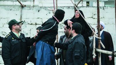 The mother, right, of Abdolah Hosseinzadeh, who was murdered in 2007, slaps Balal, who killed her son, during the execution ceremony in the northern city of Nowshahr in Iran on April 15 just before she removed the noose around his neck with the help of her husband, sparing the life of her son’s convicted murderer. Arash Khamooshi / AFP